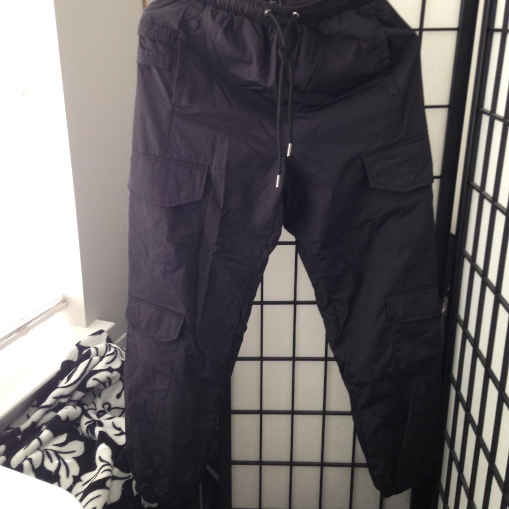 Plenty of Side Pockets and Large Back Slip Pockets, Pull String